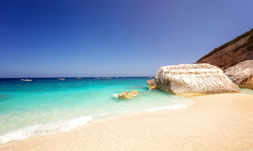 a picture of rocks on the beach of cala mariolu near cala gonone in east sardinia