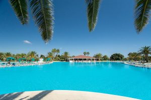 a picture of the large outdoor pool at club hotel marina beach in orosei east sardinia