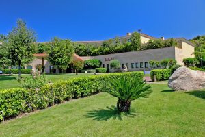 a picture of the green gardens at the four-star Geovillage Sport & Wellness Resort in Olbia Sardinia