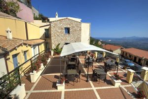 a picture of the outdoor terrace at Bia Maore, a three-star hotel in Baunei, east Sardinia, Italy.