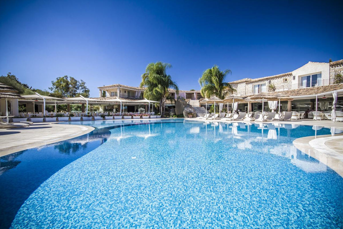 a picture of the large outdoor pool at Hotel Villas, a four-star holiday resort in south-east Sardinia, Italy.
