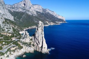 a picture of Pedra Long, a pinnacle 120 meters high in Baunei, east Sardinia, Italy.