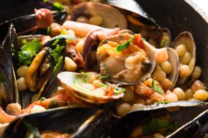 a picture of a plate of Sardinian Fregula with seafood.