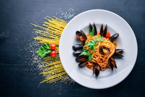 a picture of a plate with Spaghetti, Cozze, Vongole E Datterini (Pasta with mussels and seafood)