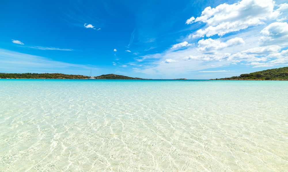 a picture of the clear waters at cala brandinchi beach in san teodoro sardinia