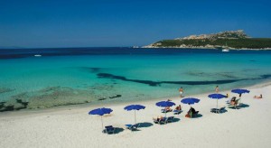 a picture of the private beach at the colonna grand hotel in capo testa sardinia