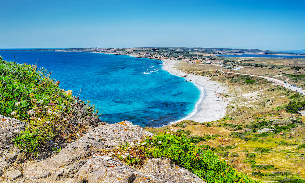 a picture of san giovanni di sinis beach in oristano sardinia