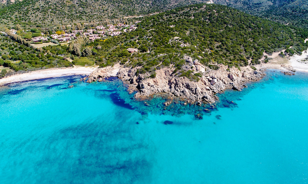 an aerial picture of perda longa beach near chia in south sardinia, italy.