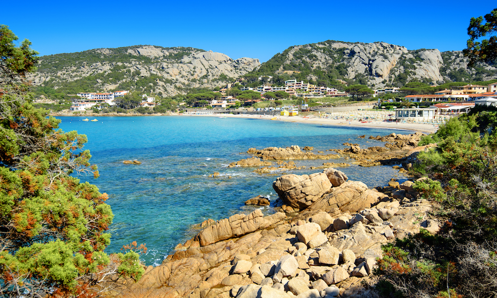 a picture of the beach at Baia Sardinia near Porto Cervo in Sardinia Italy.