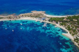 an aerial picture of a few beaches on the coast of Isola Tavolara in north-east Sardinia, Italy.