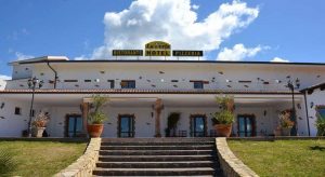 a picture of la perla hotel near the beach of porto pino in south sardinia