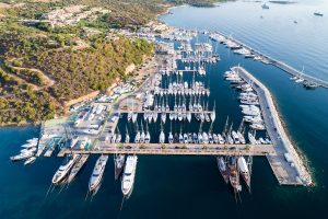 an aerial picture of yachts anchored at marina di portisco on the emerald coast in sardinia italy