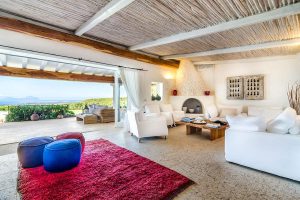 a picture of the sun terrace and spacious living area of a villa in Abbiadori, in Costa Smeralda, Sardinia, Italy.