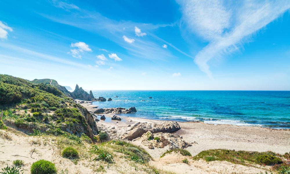 a picture of rena majore beach in north sardinia italy