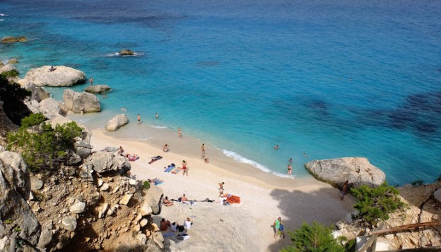 a picture of su portu beach in chia sardinia