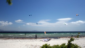 a picture of kitesurfers on is solinas beach in south sardinia