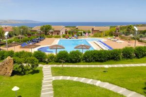 the outdoor pool and sun terrace at Cala Rosa Club Hotel in Stintino, north-west Sardinia, Italy.