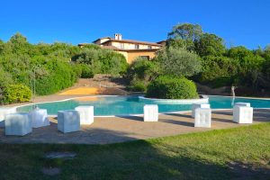 a picture of the outdoor pool and sun terrace at the three-star Hotel Giardino Corte Rubja in Iglesias south-west Sardinia Italy.