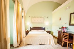 a picture of a room at hotel il duomo in oristano west sardinia italy