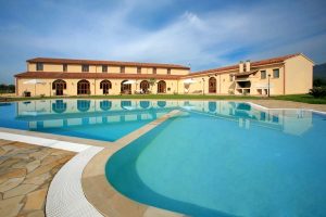 a picture of the large outdoor pool at hotel sport village in iglesias Sardinia Italy