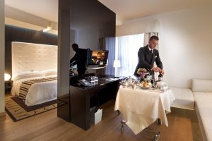 a picture of a room with room service at the sardegna hotel in cagliari sardinia