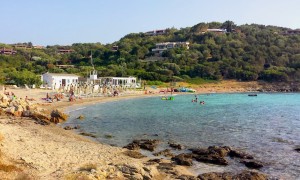 a picture of spiaggia dei sassi in porto rotondo sardinia