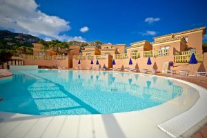 a picture of the outdoor pool at hotel costa paradiso in north sardinia italy