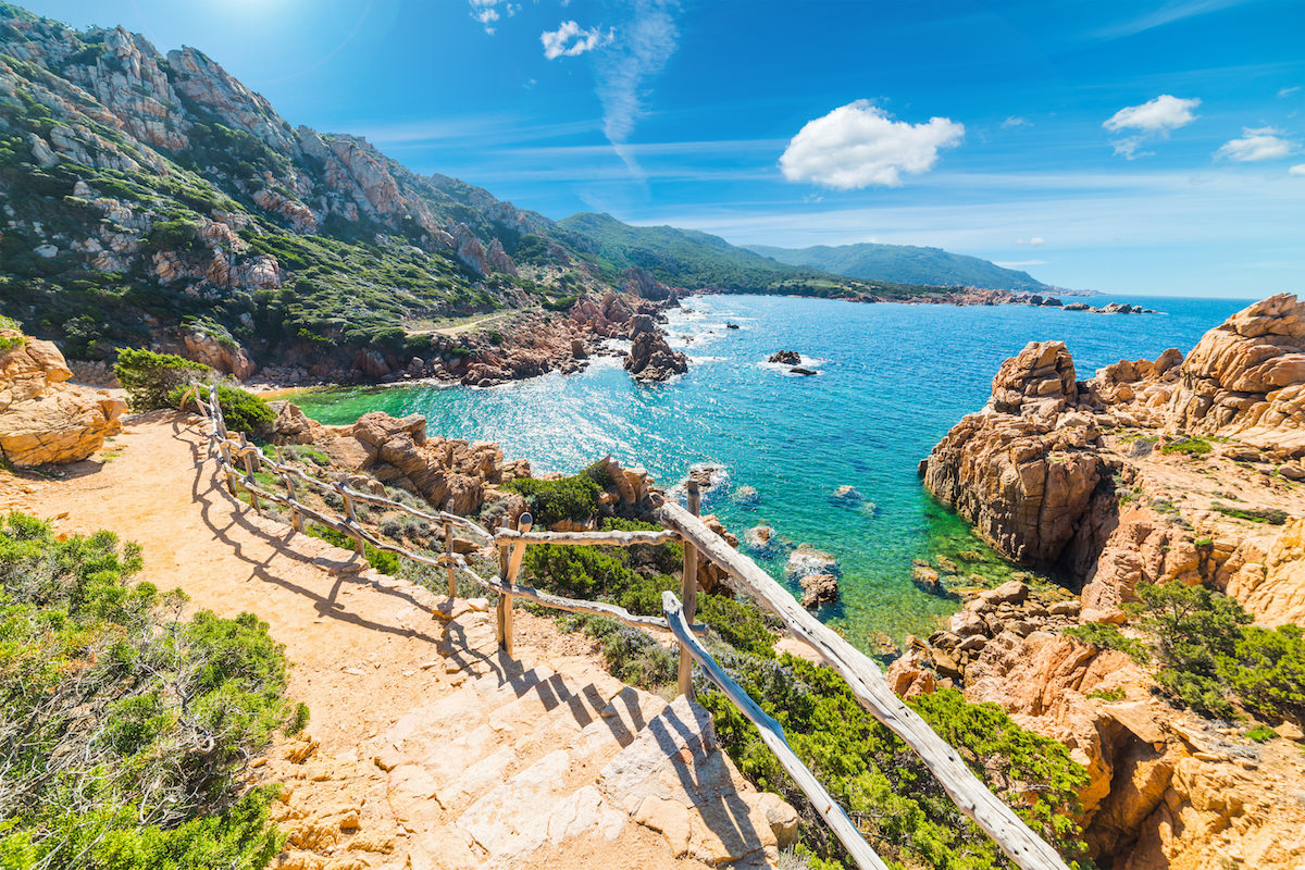 a picture of a stairway along the coastline of Costa Paradiso in north Sardinia, Italy.