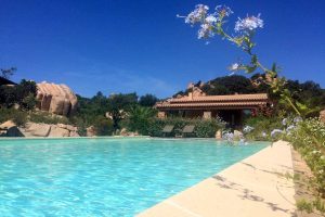 a picture of the outdoor pool at villetta sara in costa paradiso north sardinia