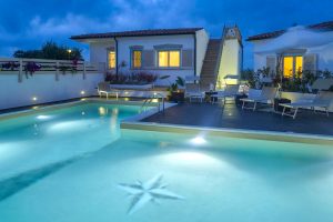 a picture of the pristine outdoor pool at Residence Il Faro in Capo Testa north Sardinia Italy