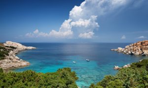 a picture of two baots at spiaggia di cala spinosa in capo testa north sardinia