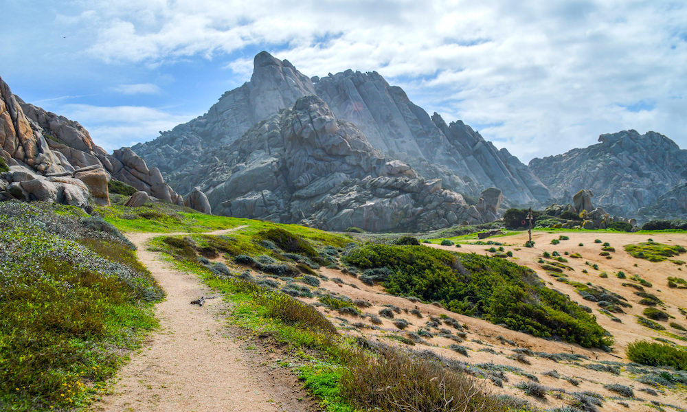 a picture of a hiking trail to valle della luna in capo testa north sardinia