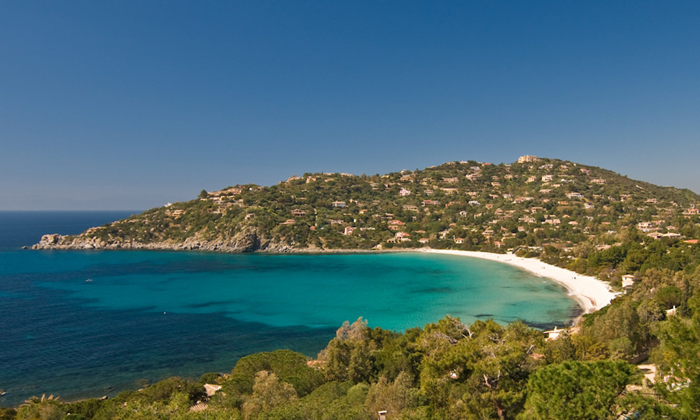 a picture of the beach at torre delle stelle in south sardinia italy