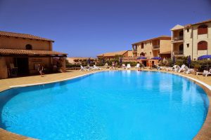 a picture of the outdoor pool at Club Esse Posada Beach Village in Palau, north Sardinia, Italy.