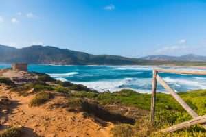 a picture of waves rolling at Waves at Spiaggia di Porto Ferro