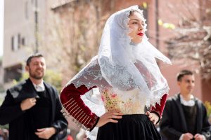 a picture of a woman wearing a traditional Sardinian costume