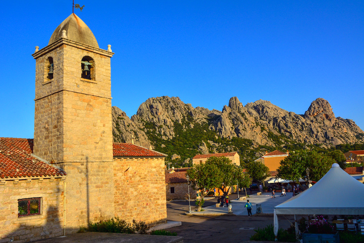 A picture of the catholic church (Chiesa di San Pantaleo) and main square of San Pantaleo in north-east Sardinia, Italy.