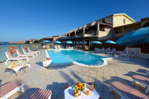 a picture of the sun terrace and outdoor pool at Hotel Corallo in Isola Rossa, north Sardinia, Italy.