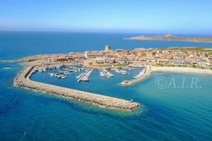 an aerial picture of the harbor in Isola Rossa, north Sardinia, Italy.