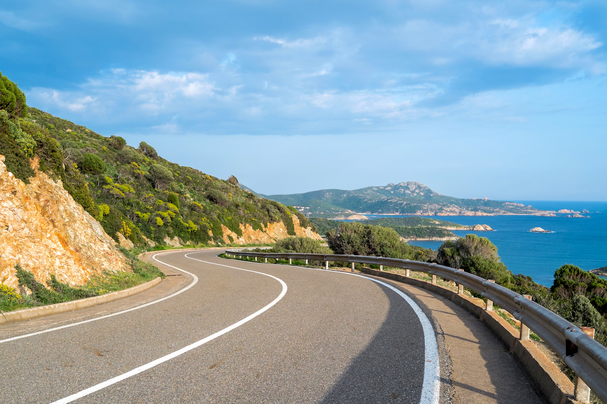 a picture of a road along the coast in Teulada, Sardinia, Italy.