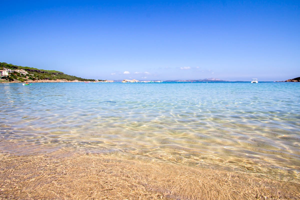 a picture of the shallow and clear waters at Cala Tremonti, a small beach near Baja Sardinia on the Costa Smeralda, north-east Sardinia, Italy.