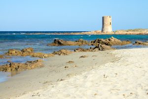 a picture of an ancient watchtower near Spiaggia Iscraios, in Posada, province of Nuoro, east Sardinia, Italy.