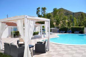 the outdoor pool and sun terrace at Hotel Village Fior di Sardegna in La Caletta, east Sardinia, Italy.