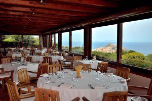 an inside look of Restaurant Baga Baga with views of the medieval town of Castelsardo in north Sardinia Italy