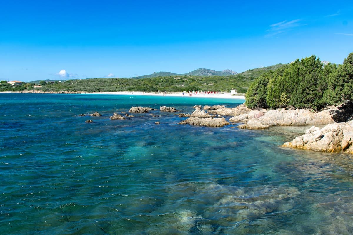 crystal clear blue waters at the beach named Spiaggia Cala Banana, near the city of Olbia, in north-east Sardinia, Italy.