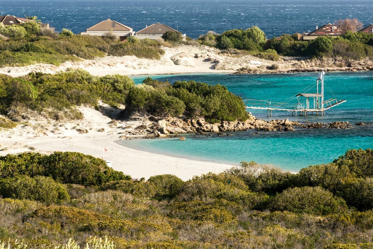 Two Sardinian beaches named Spiaggia Cala Banana and Spiaggia di Nodu Pianu, near the village of Pittulongu, in north-east Sardinia, Italy.