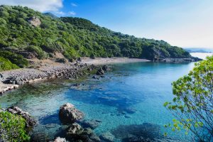 the beach named Spiaggia di Porto Mànagu near the medieval village of Bosa, in west Sardinia, Italy.