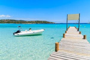 Explore the sparkling aquamarine waters of Sardinia with a dinghy.