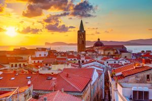 Sunset over Alghero, in north-west Sardinia, Italy.