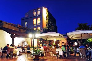 the outisde terrace at Ristorante Sa Pischedda in Bosa, west Sardinia, Italy.